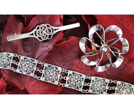 A Danish silver brooch by Niels Eric From, of stylised floral form, stamped mark, 4cm wide, a silver filigree bracelet by Hug