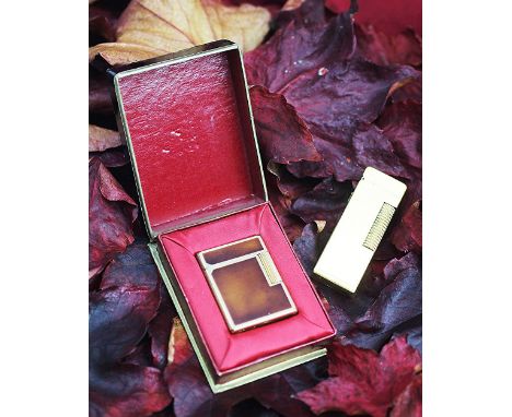 A Dupont, Paris lighter with tortoiseshell effect enamelling, stamped 'BS8250', within original box and a Dunhill example (2)