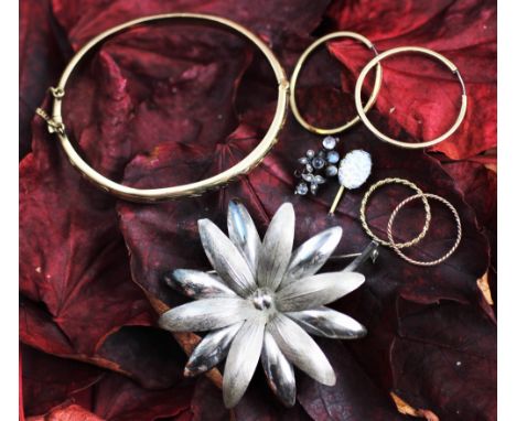 A 9ct yellow gold hinged bangle, weight 6.8gms, four gold hoop earrings, two stick pins and a silver brooch in the form of a 