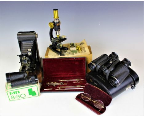 A selection of items to include a pair of Pentax Asahi binoculars, a USSR MN monocular, a silver collared part cased carving 