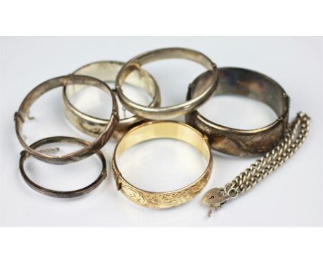 A collection of five silver hinged bangles, a silver babys bracelet, along with a silver curb link bracelet, gross weight 131