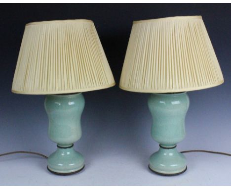 A modern pair of table lamps, in celadon style crackle glaze, 40cm high, with a pair of shades (2) CONDITION REPORT: Lighting