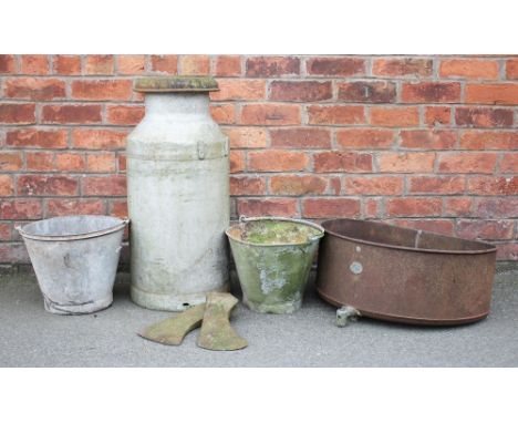A selection of vintage garden items, comprising a cast iron stove, with a milk churn and cover, a pair of buckets, enamel bow