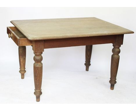 A late Victorian oak dining table, the rectangular top with a moulded edge, with two drawers, one with an enamel label for Jo