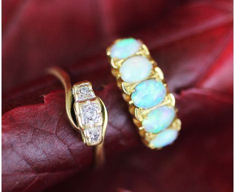 A five stone opal ring, the five opals all set in 18ct yellow gold and a three stone diamond ring with diagonal setting, all 