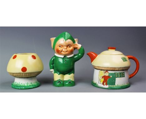 A Shelley Mabel Lucie Atwell three piece tea service, Rd No. 724421, comprising;  a house tea pot and cover, an elf jug, and 