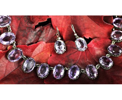 An amethyst riviere necklace and earrings, each stone claw set in decorative white metal claw setting, with bolt ring clasp, 