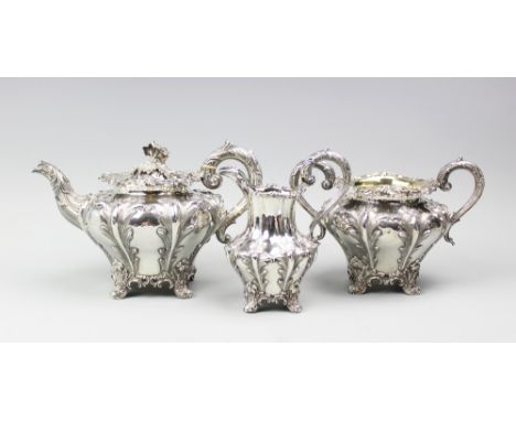 A Victorian silver three piece tea service, Charles Reily and George Storer, London 1842, each piece of compressed melon form