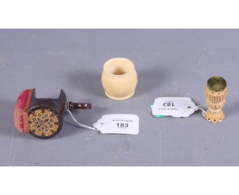 A 19th century Tunbridge ware sewing clamp and pin cushion, a vegetable ivory pin cushion and a turned ivory napkin ring