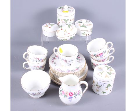 A Wedgwood bone china "Devon Sprays" part tea service for six and five Wedgwood "Wild Strawberry" jars and covers