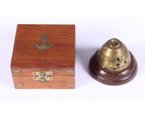 A 20th century brass cased nautical compass and a brass WWI shell timer paperweight, on stepped hardwood base, 3" high