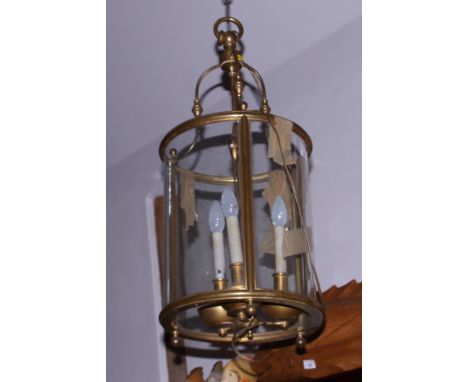 A brass three-light ceiling lantern of Georgian design, 30" high