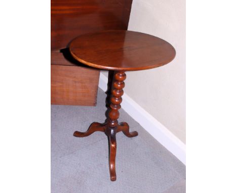 A 19th century walnut oval wine table, on bobbin turned column and tripod splay supports, 21" wide