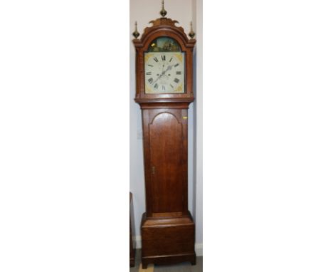A late Georgian provincial oak long case clock with painted arch top dial, rocking boat and eight-day striking movement by Up