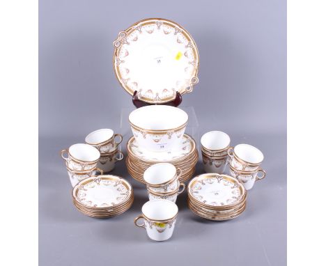An Edwardian bone china part tea service with floral gilt decoration