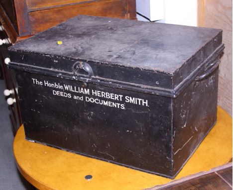A black japanned metal trunk
