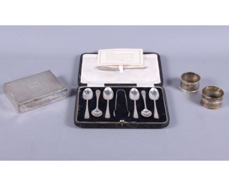 Two silver napkin rings, 2.3oz troy approx, a silver engine turned cigarette box and a set of silver shell pattern coffee spo