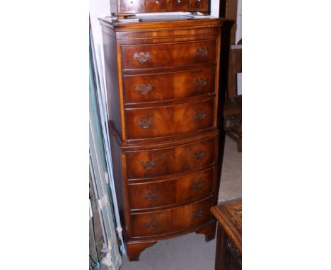 A 1930s walnut bowfront chest of six long drawers, on bracket feet, 22" wide