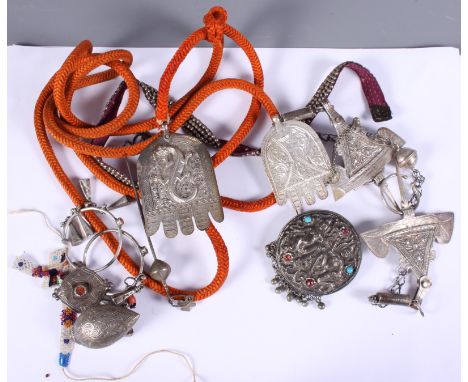 A pair of 19th century silver, possibly Ottoman, cloak hooks, impressed marks verso, together with various other white metal 