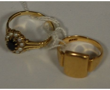 An unmarked yellow metal signet ring, and a ladies 9ct gold sapphire and seed pearl set dress ring (2)