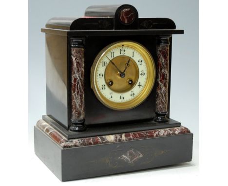 A circa 1900 slate mantel clock having a French brass 8-day striking movement