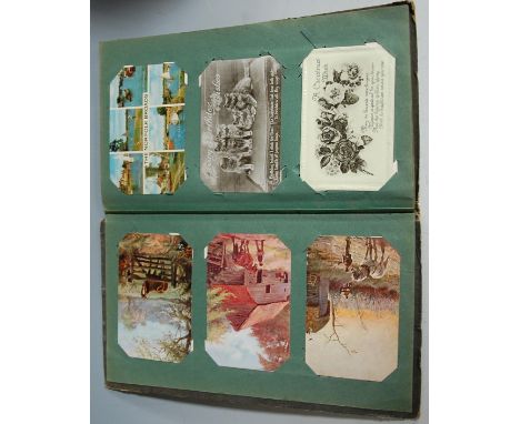 An early 20th century Art Nouveau postcard album to include; topographical and Royal family etc 