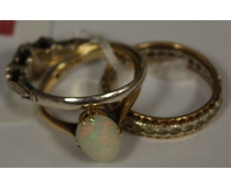 A ladies 9ct gold and opal set dress ring, and two others (3)