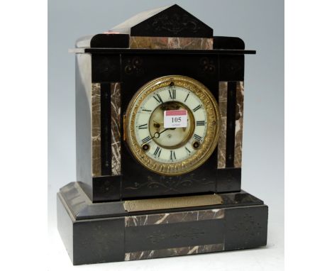 A circa 1900 slate mantel clock with presentation plaque, visible escapement and striking movement
