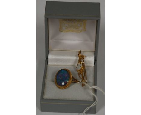 A ladies 9ct gold and cabochon opal  set dress ring and a 9ct gold opal set bar brooch (2)