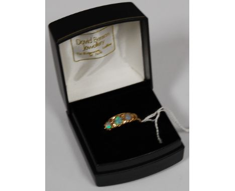 A ladies 18ct gold and opal set dress ring, 4.6g