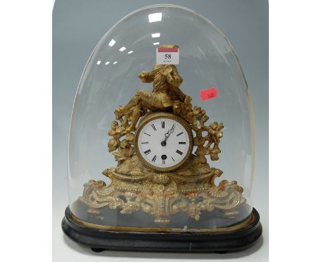 A late 19th century French gilt metal mantel clock having 8-day brass cylinder movement and all housed under a glass dome, gr