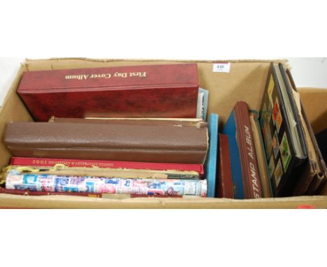 A box of stamp albums and first day covers to include; 2001 collection of Australian stamps, various African stamps, stamp co