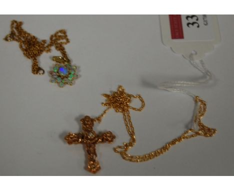 A modern 9ct gold and opal set flower head pendant on fine link neck chain and a 14ct gold diamond set cross pendant on fine 