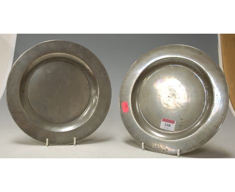A pair of 19th century pewter plates bearing monogram and maker's mark for William Phillips