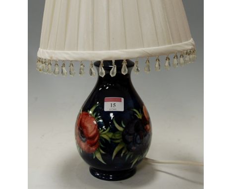 A Moorcroft Hibiscus pattern table lamp of baluster form, with silk shade and drops