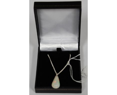 A 9ct Ethiopian Welo opal pendant on chain 