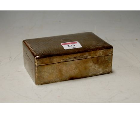 An engine turned silver table cigarette box