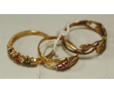 A ladies 9ct gold ruby, sapphire, emerald and diamond set dress ring, and one other yellow gold ruby set ring, and an Art Nou