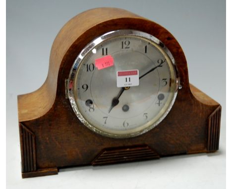 An early 20th century oak cased striking and chiming mantel clock 