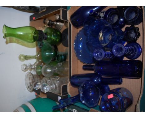 Two boxes of mixed glass to include; Bristol Blue glass, green glass oil lamp, decanters etc 