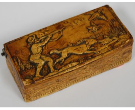 A continental treen snuff box, the hinge cover carved in relief with shooting scene