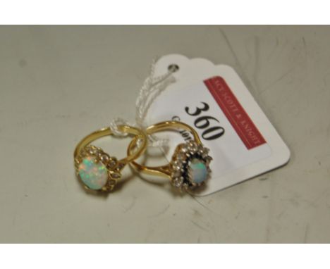 A ladies 9ct gold opal and white sapphire set cluster ring, and one other similar (2)