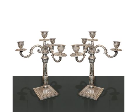 Pair of 4-light silver candlesticks H 28 cm, base 9.5x9.5 cm. Gr 974      H 28 cm, base 9.5x9.5 cm. Gr 974     