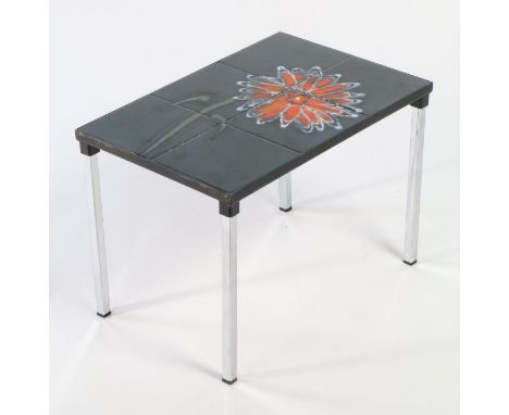 Tile topped table. The top inset with six floral tiles depicting an orange flower, raised on chrome legs. 47cm x 33cm x 32cm.