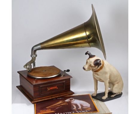 Mahogany cased gramophone (makers mark scratched), with large brass horn and a model of the HMV dog and a reproduction metal 