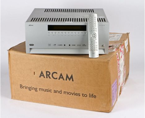 Arcam FMJ AVR-600 HDMI 7.1 Theater Receiver Preamp in silver, has nine stereo analogue inputs, also having five HDMI inputs. 