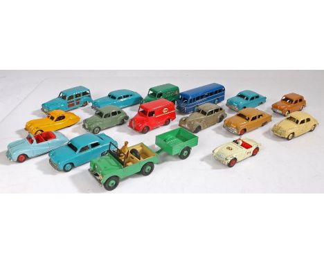 A collection of Dinky Toys diecast models and a small tin of spare tyres