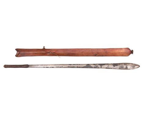 A Masai sword, Seme, blade 23", with leather bound hilt, in its leather scabbard terminating in a copper disc made from an Ea