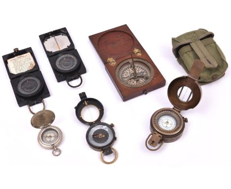 6 magnetic compasses. Including 3x WWII military compasses; a brass cased T.G. Ltd Mk.III 1940 and 2x Mk.I Marching Compasses