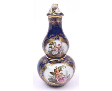 A Dresden porcelain double gourd lidded vase on dark blue base with scenes of courting couples. VGC. £40-60